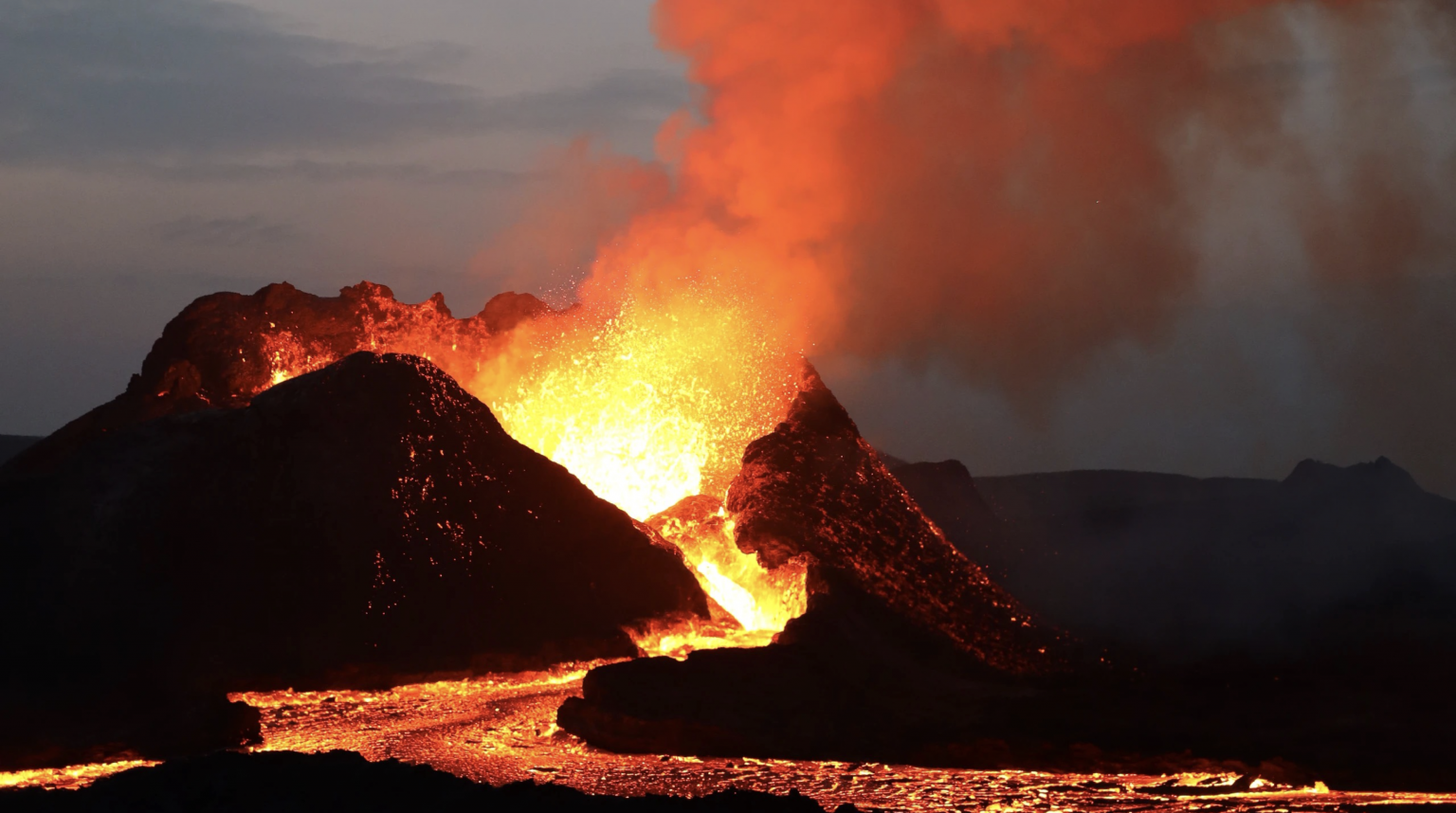 Fiery cone volcano erupting and spurting out very hot gas